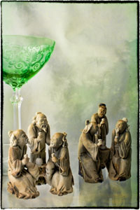 green stemmed glass with Chinese mud men